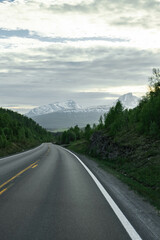 Empty road in a moody norway mountain landscape