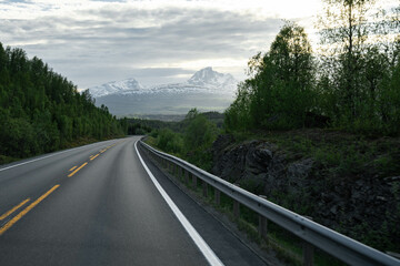 Fototapeta premium Empty road in a moody norway mountain landscape