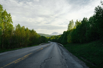 Fototapeta premium Empty road in a moody norway mountain landscape