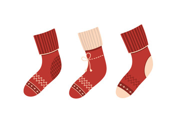 Set of red warm winter socks on white background.