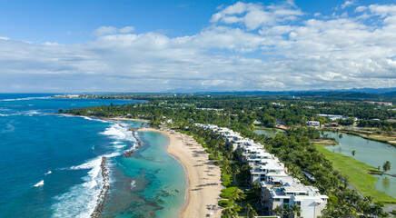 An aerial view of west beach residences Dorado Beach Resort in Puerto Rico, capturing both the...