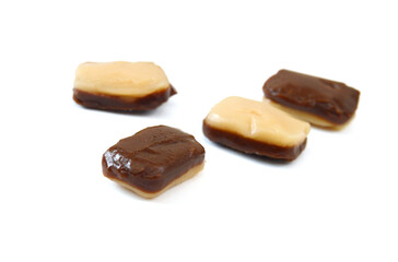 Caramel candies isolated on white background