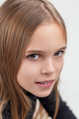 Fototapeta premium Portrait of expressive young girl showing curiosity and intellig