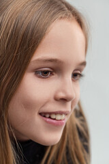 Portrait of smiling young girl expressing happiness and joy