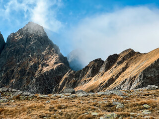 Peaceful high-altitude landscape in the Tatra mountains with foggy cloudy fall weather 
