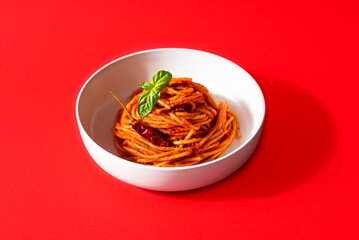 Spaghetti all'assassina is a typical Apulian recipe, Bari. Trendy first course, pasta cooked directly in a pan with tomato sauce, crunchy and spicy flavor. Red bloody color