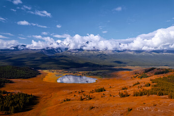 Crystal clear lake and mountain, autumn landscape Altai aerial view. Concept adventure trip in nature