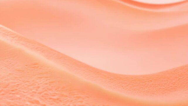 Orange-hued sand dunes with soft curves and delicate lighting, resembling a surreal desert. video