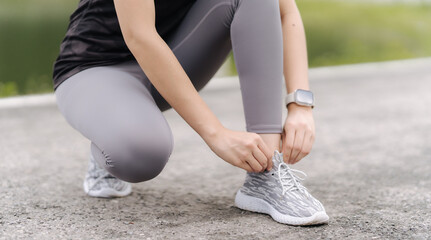 Ready to Run: A Determined Athlete Ties Her Shoes, Embracing Fitness and a Healthy Lifestyle