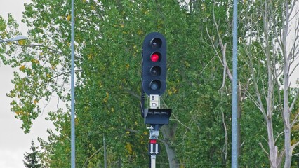 Railroad Track Junction with Railway Signal Semaphore with Red Stop Light