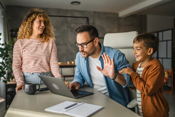 the father try to work from home while his family distracts him