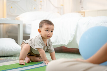Fototapeta premium Asian baby and woman doing lifestyle activities together at home.