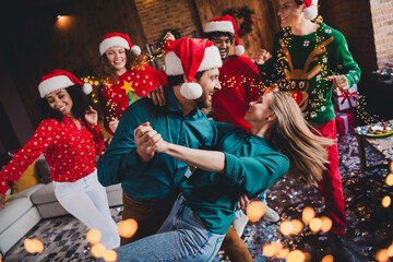 Photo of nice young people dancing couple have fun enjoy cozy christmas decoration interior house...