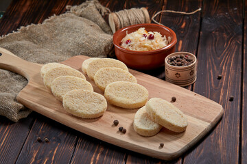 raw cutlets on the wooden board