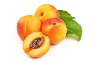 Fresh whole apricots with leaf and half with core, isolated on white background.