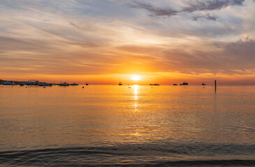 Fototapeta premium Beautiful red and orange sunrise over the sea.