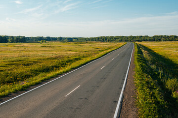 Fototapeta premium an empty road at sunset in the Orenburg region