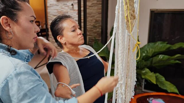 video of disabled woman learning to weave macrame