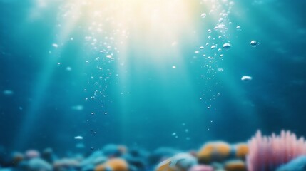Obraz premium Sunlight filters through water creating a serene underwater environment with swimming fish
