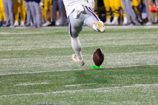 Close-up of a College football kicker on the football field