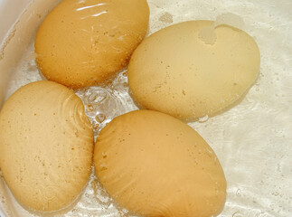 Boiled chicken eggs in a saucepan