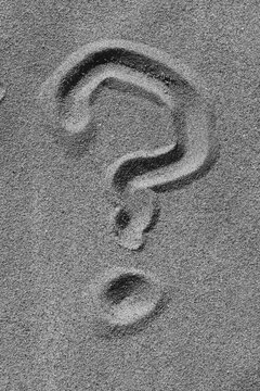 Question Mark Drawn in Sandy Beach