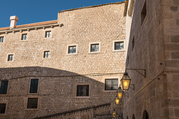 Medieval residential architecture in europe with a lamps on the wall