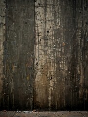 Grunge wall texture close-up in an urban alley.