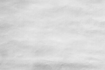 Crumpled light grey background paper texture with stains and dots