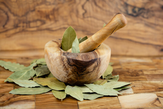 Bay leaves Laurus nobilis on olive wood