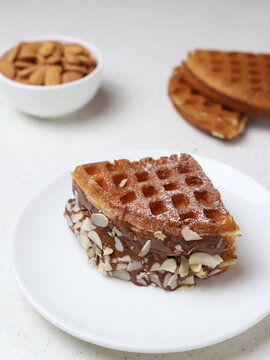 Chocolate Waffle with almond on white round palate