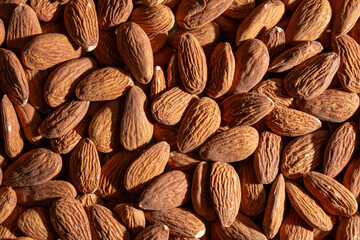 Scattered Almonds. Background from Almond Nuts. Natural High-Calorie Snacks