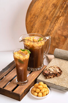 Cold and Crunchy Snack Time With Iced Tea and Puffs
