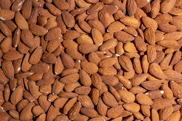 Scattered Almonds. Background from Almond Nuts. Natural High-Calorie Snacks