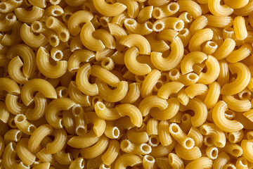 Uncooked Chifferi Rigati Pasta: A Culinary Canvas of Chifferi Rigati, Creating a Lively and Textured Background for Gourmet Cooking. Dry Pasta. Raw Macaroni - Top View, Flat Lay