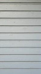 Obraz premium Weathered gray wooden shiplap wall with rustic coastal charm