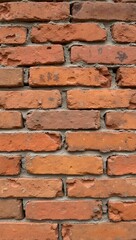 Obraz premium Rustic clay brick wall with warm tones and rough texture