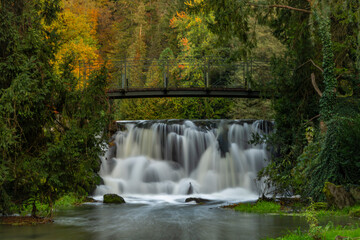 Zlaty creek and waterfall near ponds in autumn evening in Opocno town