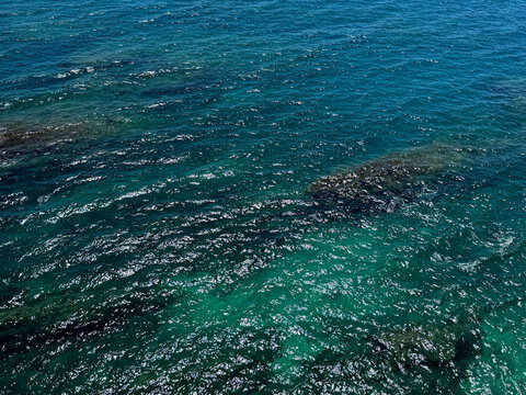 Blue turquoise sea shiny waters aerial view of Mediterranean sea.