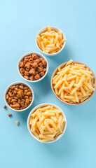 Bowls with different tasty uncooked pasta on blue background isolated with white highlights, png