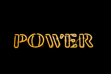 Isolated yellow neon sign that says power on black background