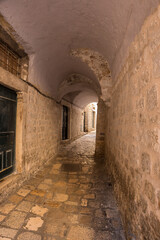 Medieval stone arched corridor with a stone floor