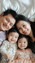 Fototapeta premium Happy Family Portrait with Two Young Children