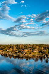 Small idyllic port in the Swedish archipelago outside of Stockholm with beautiful reflection...