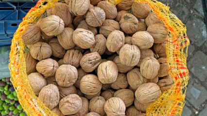 Walnuts sold in sacks at the peasant market.