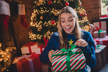 Portrait of nice young woman open giftbox wear sweater new year festive time flat indoors