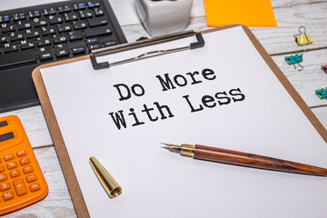 top view of a cup of coffee and a notepad with text do more with less