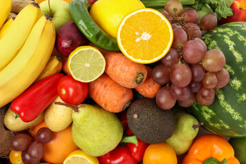 Many different fruits and vegetables as background, top view