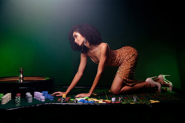 Photo of alluring hot chic lady playing in private vip poker club temptation on table neon light