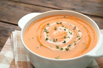 Delicious sweet potato soup with microgreens on table, closeup